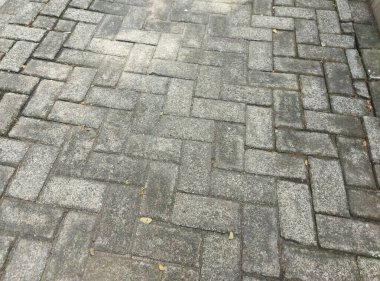 Arka plan için sokak fayanslarının gri eksili blok dokusu