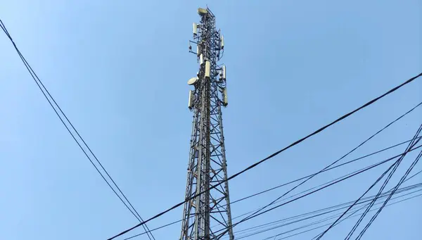 Single Base Transceiver Station (BTS) tower. The steel frame tower houses electronic communications equipment. electronic infrastructure