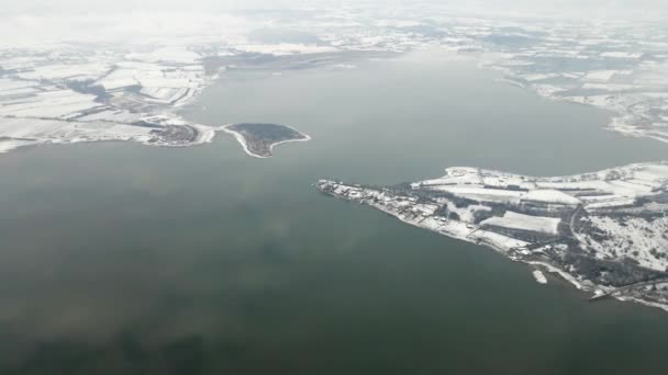 Aerial Footage Large Lake Surrounded Fields Covered Snow — Stock Video