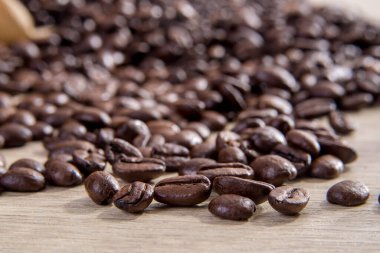 Coffee beans on table clipart