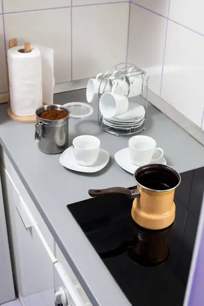 Preparing morning coffee in a kitchen