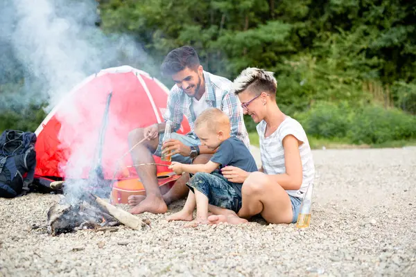 Family time in nature with campfire