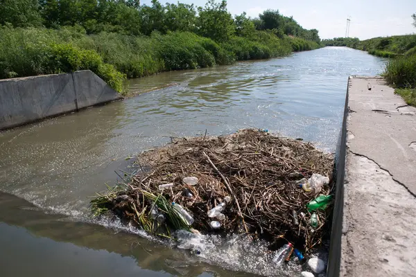 Garbage in the river. Environmental disaster.