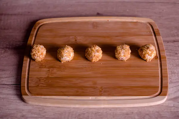 Tasty cheese balls served in a row