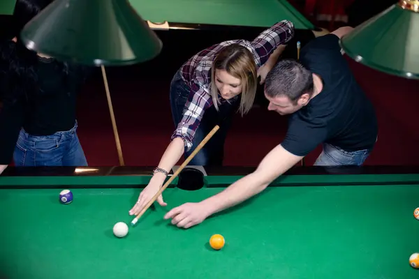 Friends Playing Billiard Royalty Free Stock Images
