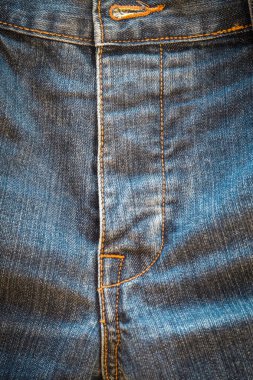 Denim kot kumaşı. Tasarım için Denim arkaplan dokusu. Kumaş kumaş. Arka plan olarak kullanılabilen mavi kot. Herhangi bir arkaplan için mavi kot dokusu.