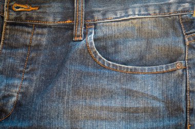 Denim kot kumaşı. Tasarım için Denim arkaplan dokusu. Kumaş kumaş. Arka plan olarak kullanılabilen mavi kot. Herhangi bir arkaplan için mavi kot dokusu.