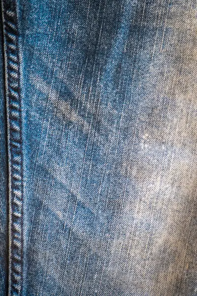 Denim kot kumaşı. Tasarım için Denim arkaplan dokusu. Kumaş kumaş. Arka plan olarak kullanılabilen mavi kot. Herhangi bir arkaplan için mavi kot dokusu.