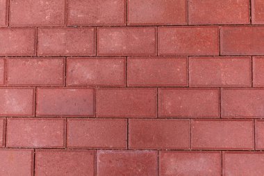 Kırmızı asfalt döşeme dokusu, dikdörtgen şekil, düz çizgiler.