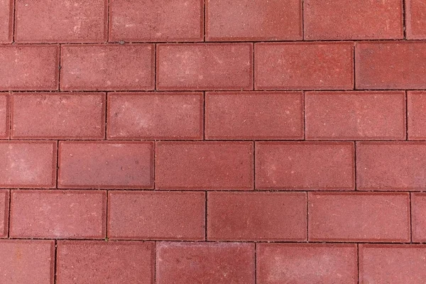 Kırmızı asfalt döşeme dokusu, dikdörtgen şekil, düz çizgiler.