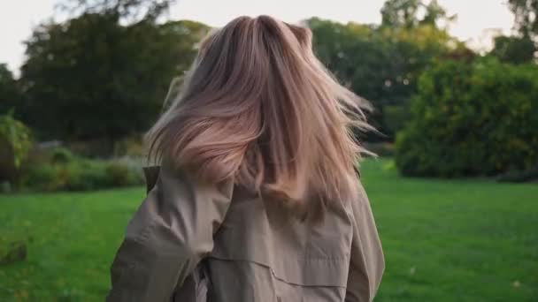 Joyful Woman Running Away Camera Blonde Woman Light Colored Coat — Stock Video