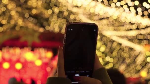 Girl Takes Picture Christmas Tree Her Phone New Years Atmosphere — Stock Video