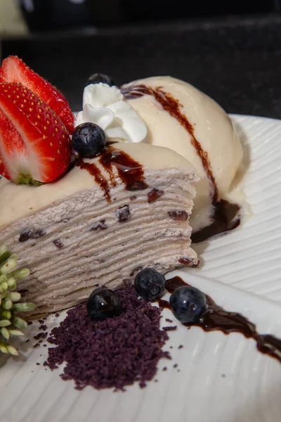 Red bean Crepe Cake served with berries