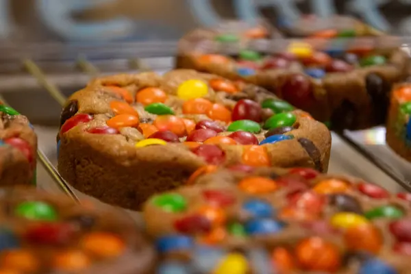 Rainbow candies as a cookie topping freshly baked