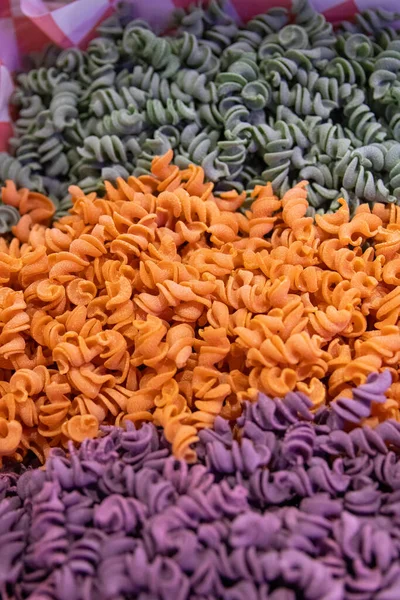 stock image Tricolored Spiral Pasta at a market