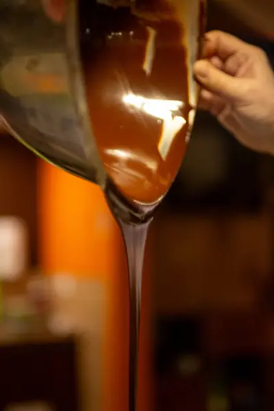 A Chocolatier Pouring Melted Chocolate