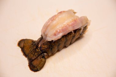Isolated Raw Lobster Tail to be cooked clipart