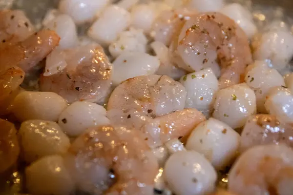 stock image Cooking Shrimp and Scallops with garlic butter