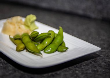 Starter of Edamame with ginger and wasabi clipart