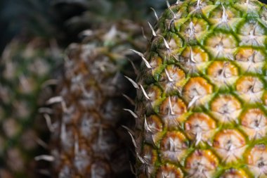 Very close view of Pineapples at a fruit vendor stand