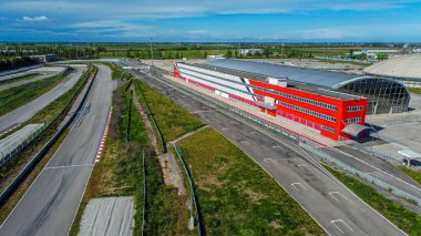 Adria racing circuit in Italy. Track abandoned for a few years where many cars and motorbikes raced. Current topic aerial view. clipart