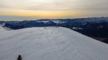 Monte Agaro mountain which is part of the Lagorai chain in Trentino. Winter period at the Brocon pass. Snow-capped mountain peak. clipart