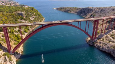 Bridge over the sea connecting two shores. Country road trip. Roads and transport infrastructure, logistic and commercial activity. Maslenica bridge. clipart