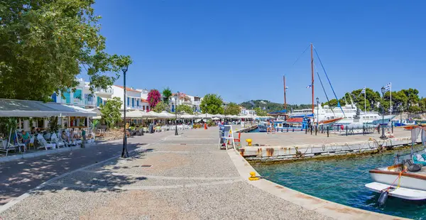 stock image Skiathos, Greece. 06-24-24. Skiathos town panorama picture looking towards the ferry port. Boats fill the foreground Part of the Sporades islands, Greece. Holiday and vacation picture.