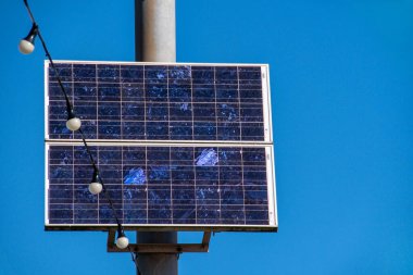 A Solar panel on streetlight lamp posts. Clean renewable energy with zero carbon emissions. Electricity generation from the sun. Solar energy. Copy space. sustainable climate visuals clipart