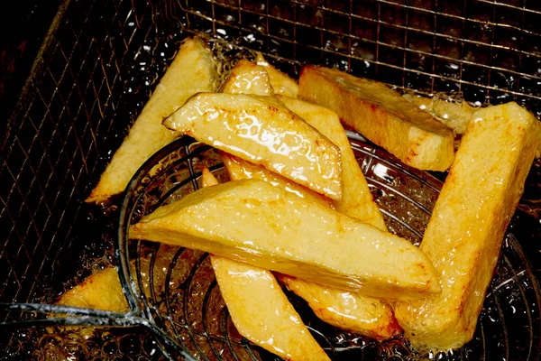 french fries in oil top shot