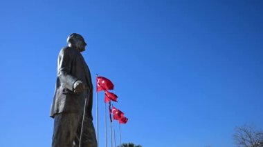 Turkey's founding leader ataturk and waving turkish flags