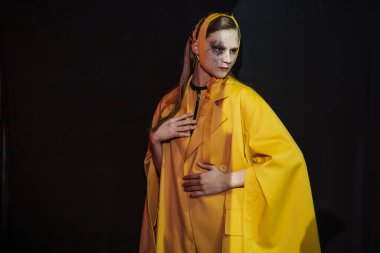 KYIV, UKRAINE - FEBRUARY 03, 2022: A model posing backstage VIKTORANISIMOV show - Ukrainian Fashion Week Fall Winter 2022-2023