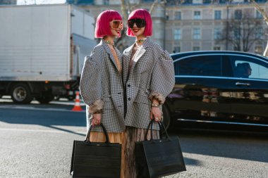 PARIS, FRANCE - FEBRUARY 26, 2019: Ami and Aya Suzuki (Amiaya tweens) seen outside DIOR show, during Paris Fashion Week Womenswear Fall/Winter 2019/20 clipart