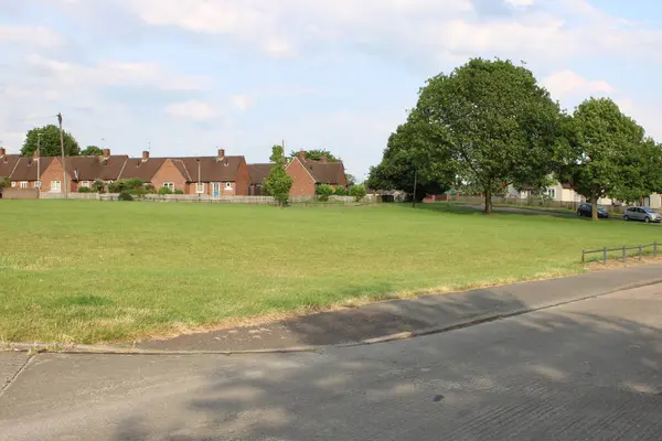Open empty grass area taken in suburbs of city UK