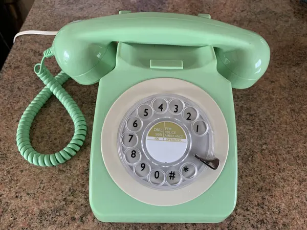 Picture of a vintage green rotary phone