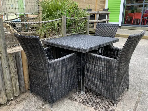 Grey Brown rattan furniture set taken on a summers afternoon