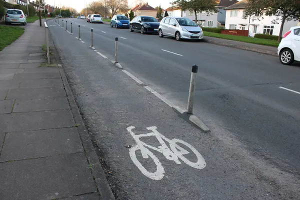 UK Cycle lane with white plastic bollards