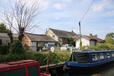 Syston, Leicestershire UK, July 5th 2024 Grand Inion Canal, L R Harrison and sons business in background, Boatyard clipart