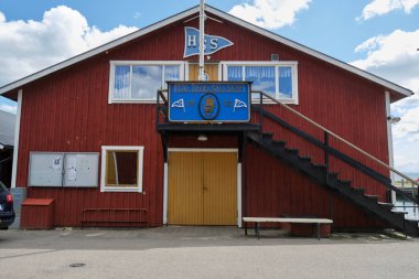 Impressions from the wooden town of Hjo at Lake Vaettern in Skaraborg Sweden on a sunny summer day clipart