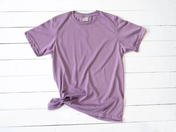 Purple T Shirt mockup on white wood background shirt templat