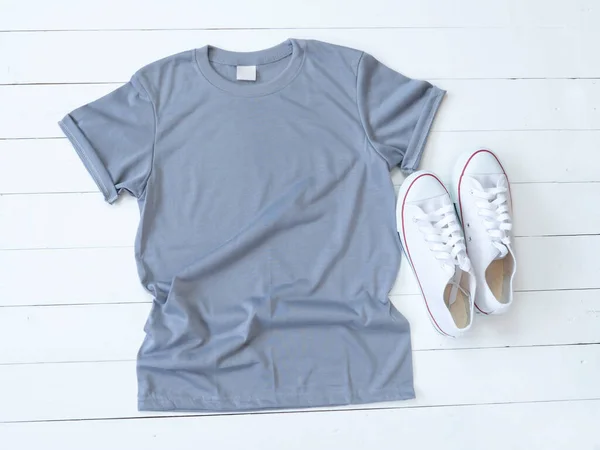 Grey Shirt Mockup Weathered Canvas Shoes White Wood Background Shirt Лицензионные Стоковые Изображения