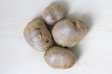 Fresh purple yam (Dioscorea alata), also known as greater yam, Guyana arrowroot, ten-months yam, water yam, white yam, or winged yam, locally called gach alu in Bangladesh. Top view. clipart