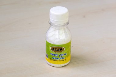 Unopened baking soda bottle. Versatile for kitchen, household cleaning, and personal care.