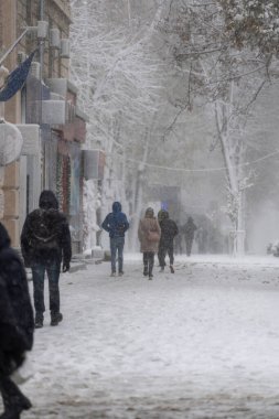 People walking in winter city street
