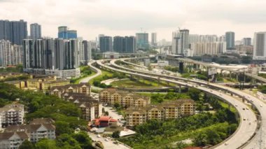 Aerial view of highway in Kuala Lumpur among residential district