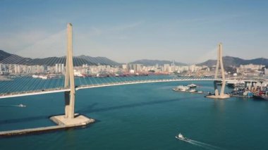 Aerial view of Busan Harbor Bridge on a sunny day