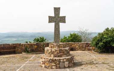 A Christian cross on the territory of Saint Peter and Paul monastery. Saint Peter and Paul monastery in Bolnisi Municipality of Kvemo Kartli region of Georgia clipart