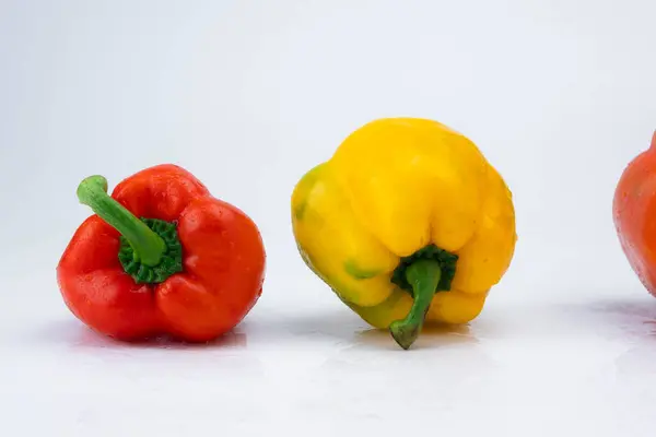 Two bell peppers isolated on white background. Bell peppers of various colors on a white background.