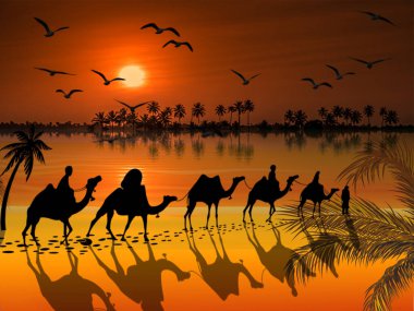 Güzel bir günbatımı arka planında deve kervanı