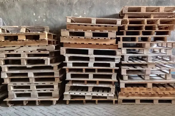Large Group of stacked brown rustic wooden pallet